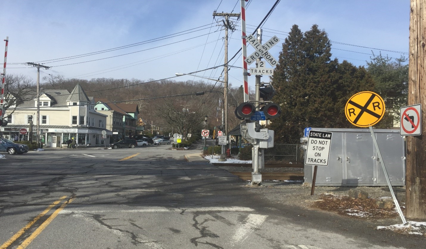 Figure 4. Example of signal cabinet obstructing pedestrian and driver view of the tracks in Katonah, NY Image Credit: Volpe Center
