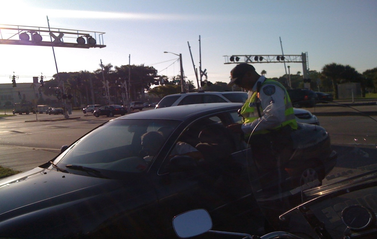 Figure 7. Example of law enforcement official enforcing traffic laws at grade crossing Image Credit: Volpe Center